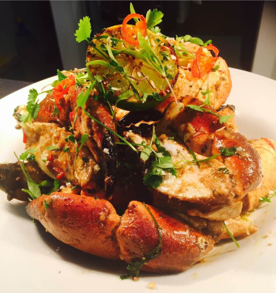 A whole Cornish crab, split and dressed with chilli, coriander and charred lime